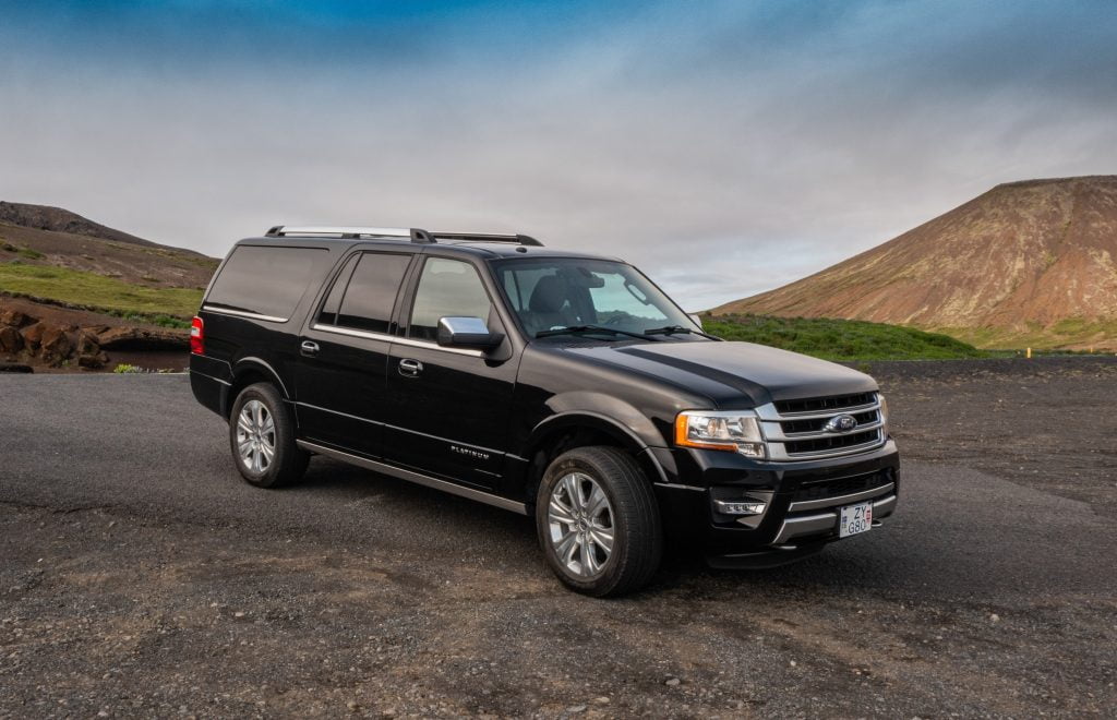 Ford-Expedition-black-front-and-side-view-on-a-photo-workshop